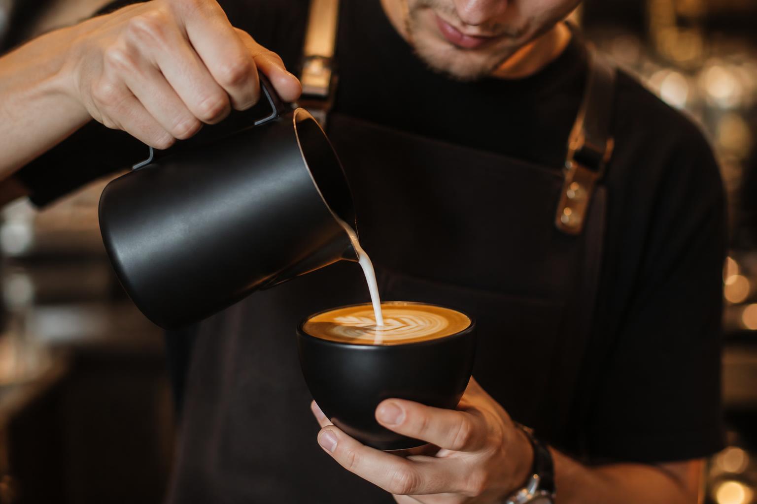 Barista pouring latte art